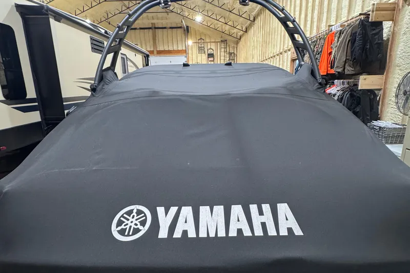 Slide: The Image of 2024 Yamaha Boats 195S covered in storage, showcasing protective cover and logo. - 11