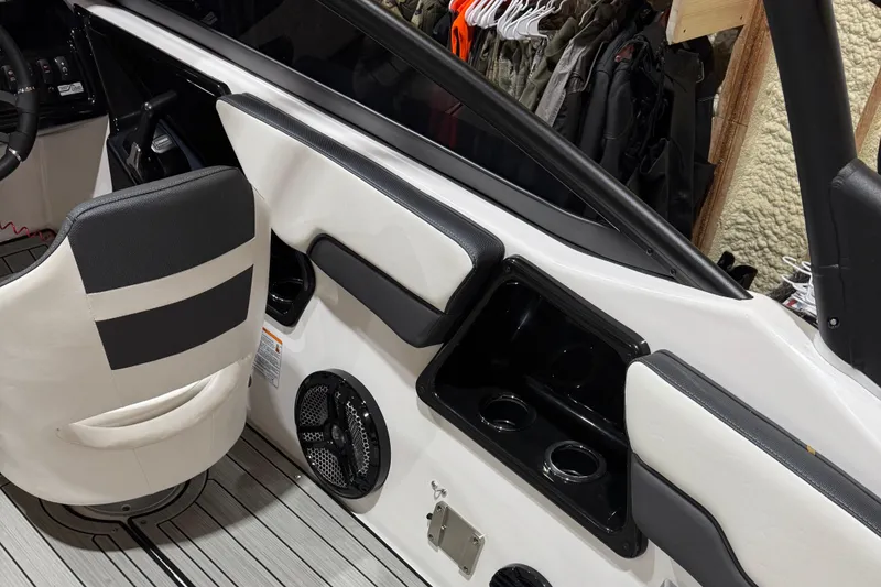 Slide: The Image of 2024 Yamaha Boats 195S interior with seating, cup holders, and speaker system. - 5