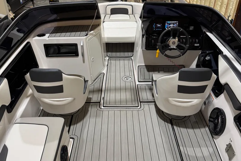 Slide: The Image of 2024 Yamaha Boats 195S interior with sleek seating and modern dashboard design. - 6