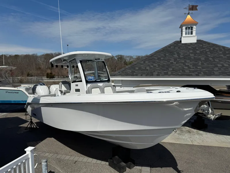 The Image of 2025 Everglades 285 Center Console boat displayed outdoors on a sunny day. - 0