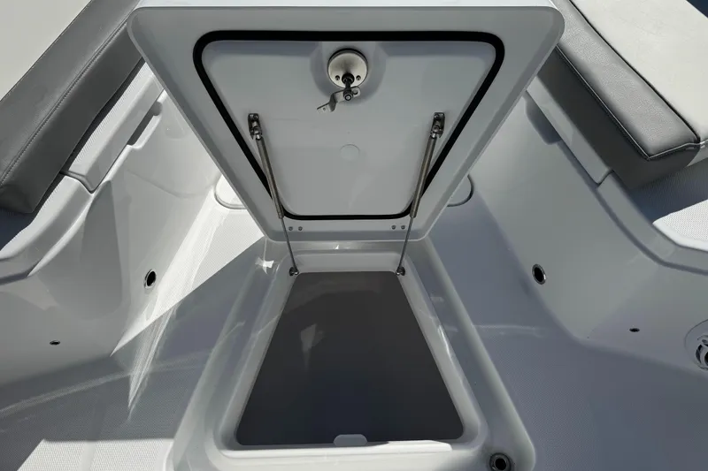 Slide: The Image of Open storage compartment on 2025 Everglades 285 Center Console boat. - 13