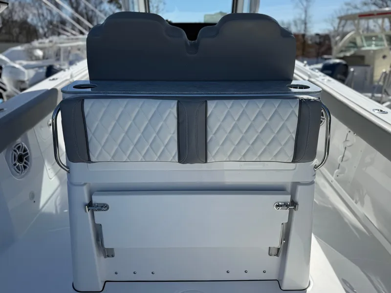 Slide: The Image of 2025 Everglades 285 Center Console boat interior with quilted seating and storage. - 18