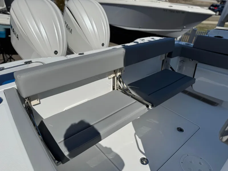 Slide: The Image of 2025 Everglades 285 Center Console boat with foldable seating and dual Yamaha engines. - 23