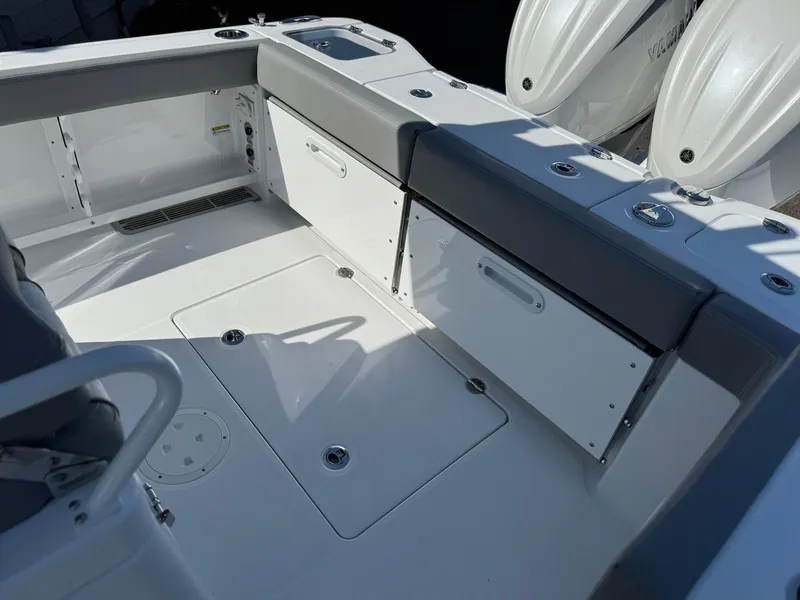 Slide: The Image of 2025 Everglades 285 Center Console boat interior with seating and storage compartments. - 24