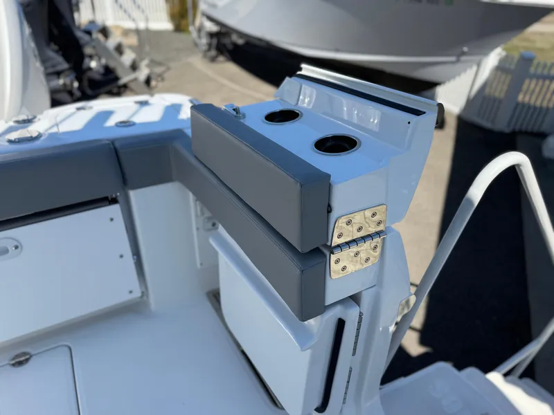 Slide: The Image of 2025 Everglades 285 Center Console boat with cup holders and storage compartment. - 25