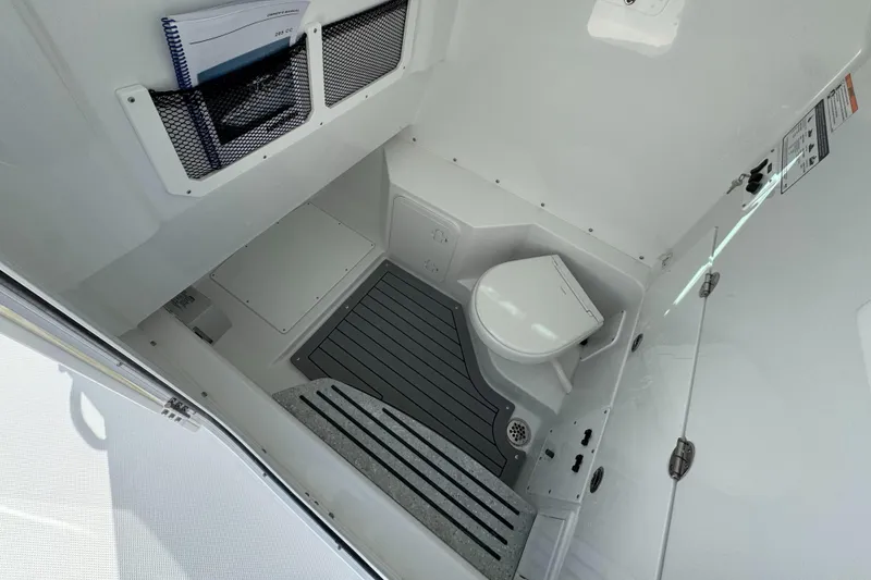 Slide: The Image of Interior of 2025 Everglades 285 Center Console boat with compact marine toilet. - 27