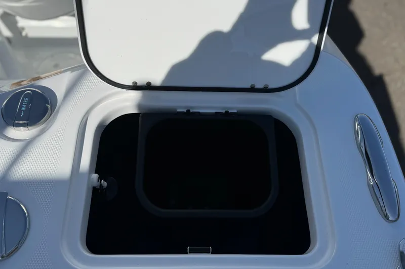 Slide: The Image of Open storage compartment on 2025 Everglades 285 Center Console boat. - 32