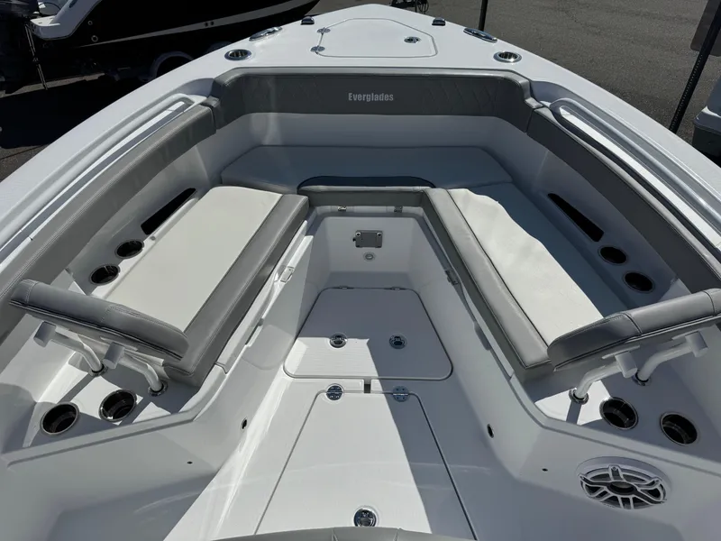 Slide: The Image of 2025 Everglades 285 Center Console boat interior with cushioned seating and cup holders. - 4