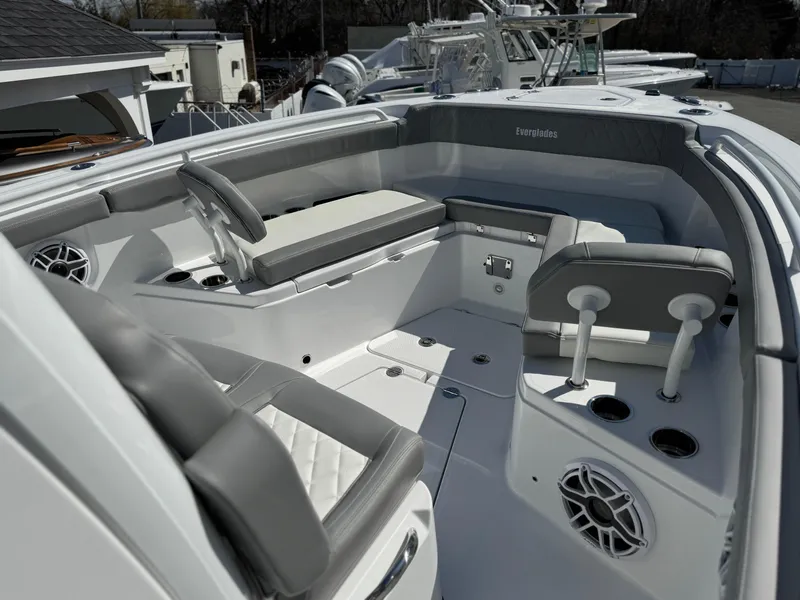 Slide: The Image of 2025 Everglades 285 Center Console boat interior with seating and cup holders. - 7