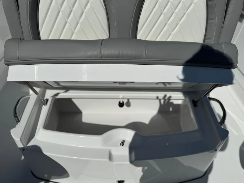 Slide: The Image of 2025 Everglades 285 Center Console seat with open storage compartment. - 9
