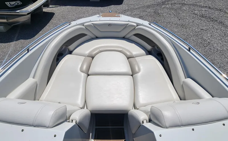 Slide: The Image of 2008 Crownline 240LS boat interior with white leather seating and spacious layout. - 13