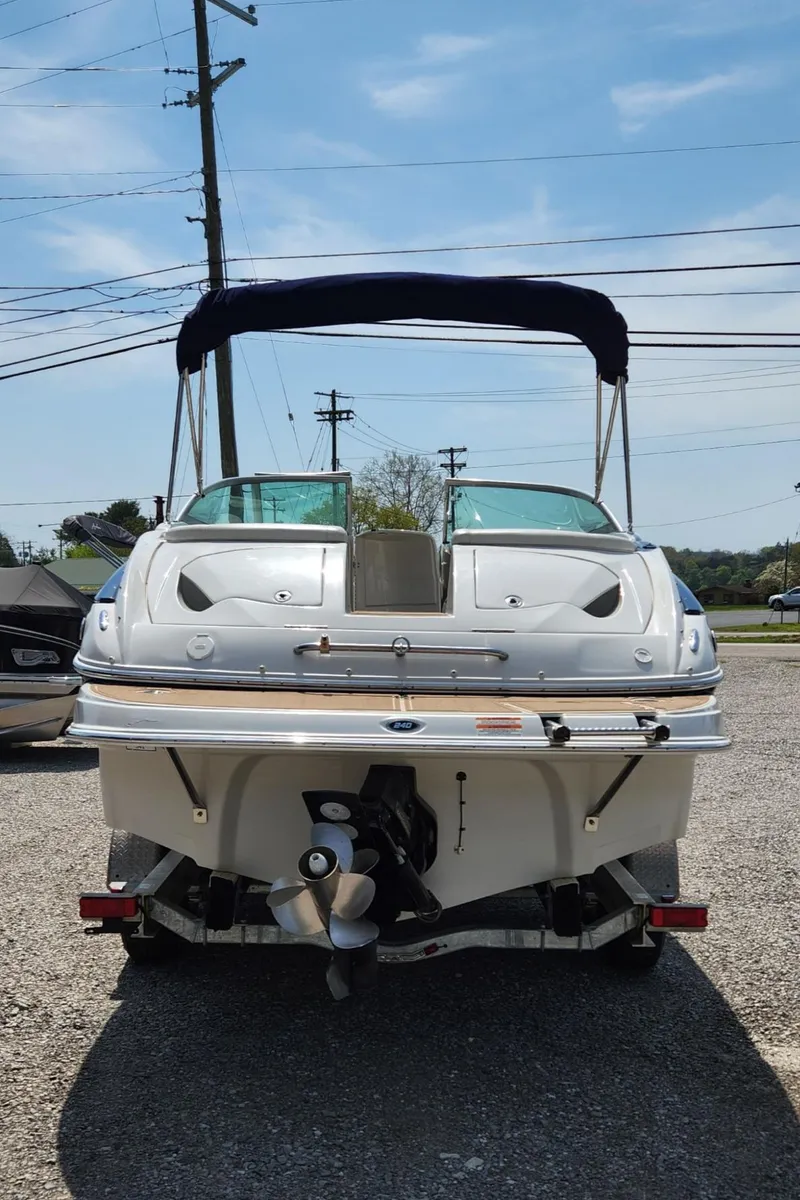 Slide: The Image of 2008 Crownline 240LS boat, rear view, on a trailer, sunny day. - 3