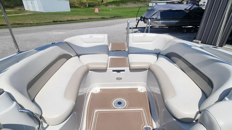 Slide: The Image of 2008 Crownline 240LS boat interior with spacious seating and sleek design. - 6