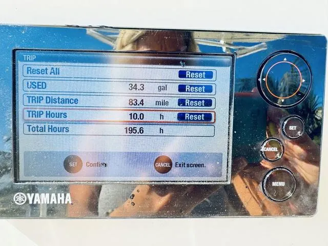 Slide: The Image of Yamaha boat display showing trip data: 34.3 gallons used, 83.4 miles traveled, 10 hours trip time. - 14