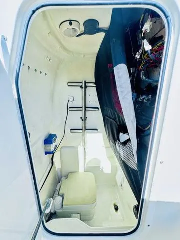 Slide: The Image of 2011 Hydra-Sports 2300CC boat interior with storage and equipment. - 15