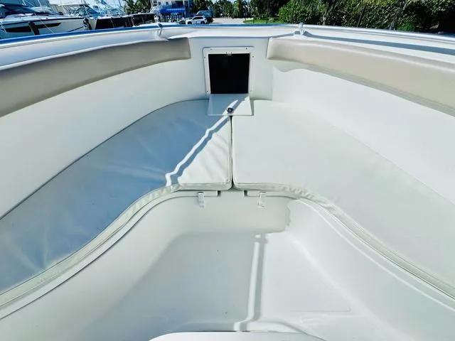 Slide: The Image of 2011 Hydra-Sports 2300CC boat interior with cushioned seating and storage compartment. - 17