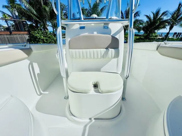 Slide: The Image of 2011 Hydra-Sports 2300CC boat interior with seating, surrounded by tropical palm trees. - 21