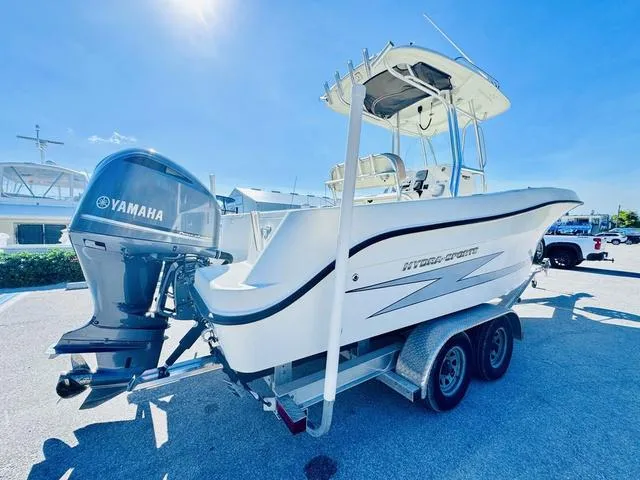 Slide: The Image of 2011 Hydra-Sports 2300CC boat on trailer with Yamaha outboard motor, parked outdoors. - 23