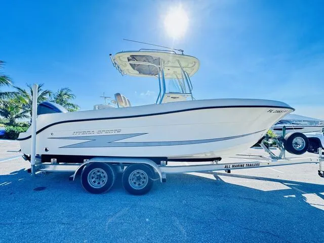 Slide: The Image of 2011 Hydra-Sports 2300CC boat on trailer under clear blue sky. - 24