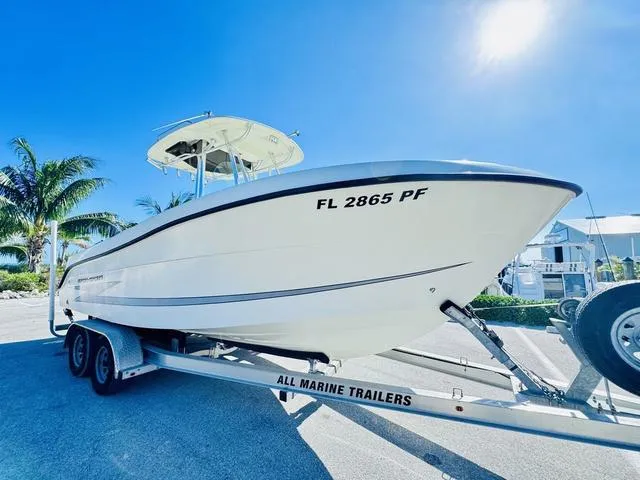 Slide: The Image of 2011 Hydra-Sports 2300CC boat on trailer, sunny day, palm trees in background. - 25