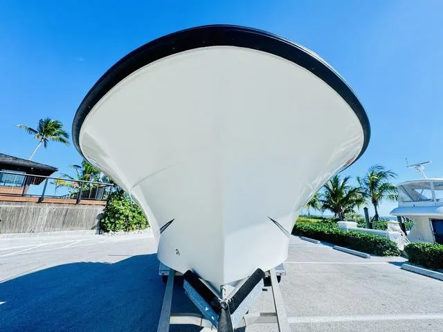 Slide: The Image of 2011 Hydra-Sports 2300CC boat on trailer, parked under clear blue sky. - 26