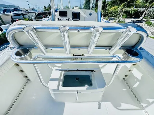 Slide: The Image of 2011 Hydra-Sports 2300CC boat interior with rod holders and storage compartment. - 9