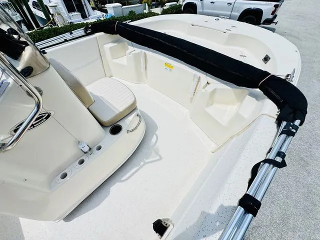 Slide: The Image of 2015 Carolina Skiff 198DLX boat interior with seating and console. - 11
