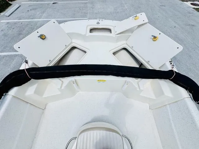 Slide: The Image of 2015 Carolina Skiff 198DLX boat interior with open storage compartments. - 12