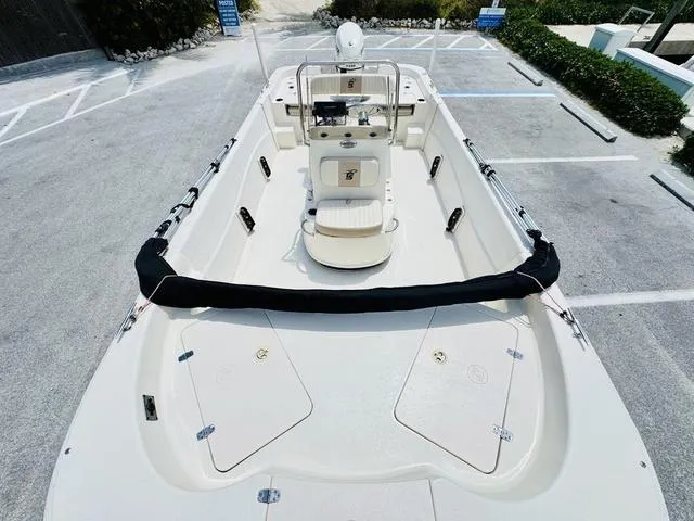 Slide: The Image of 2015 Carolina Skiff 198DLX boat in a parking lot, top view. - 15
