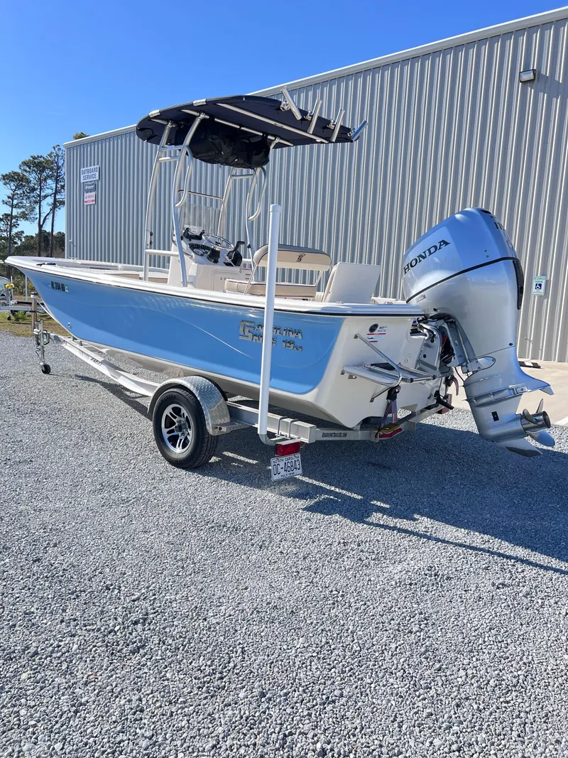 Slide: The Image of 2022 Carolina Skiff 19LS boat with Honda outboard motor on trailer. - 4