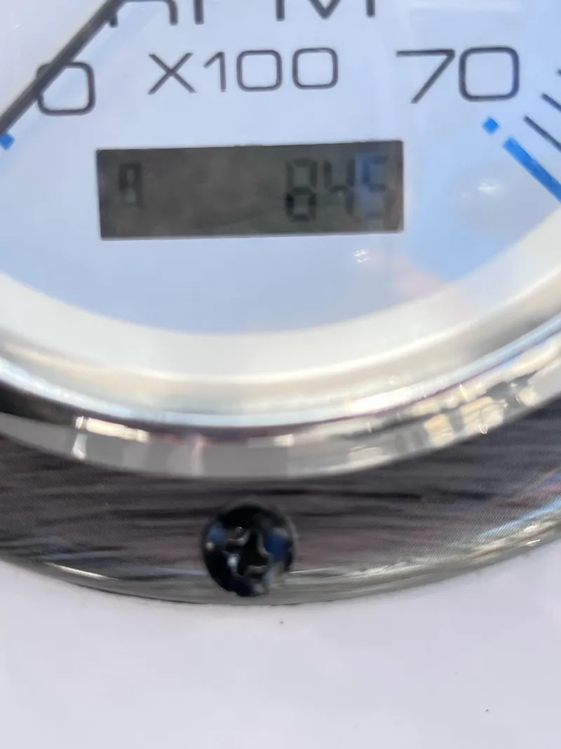 Slide: The Image of Close-up of a 2022 Carolina Skiff 19LS RPM gauge displaying 845 RPM. - 5