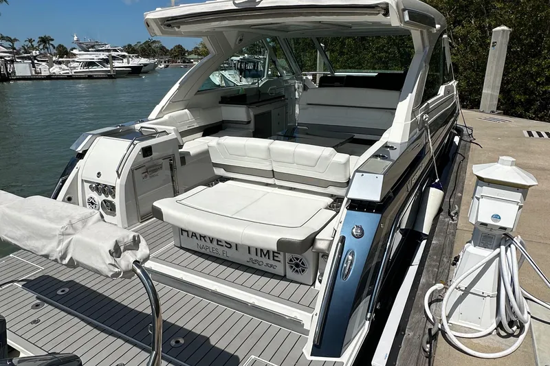 Slide: The Image of 2022 Formula 380 Super Sport Crossover docked, featuring spacious seating and sleek design. - 10