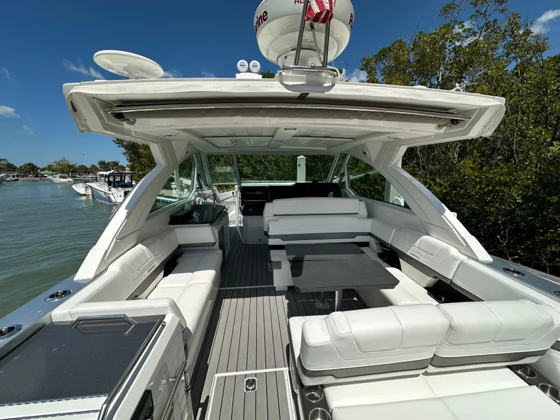 Slide: The Image of 2022 Formula 380 Super Sport Crossover boat with spacious seating and sleek design. - 11