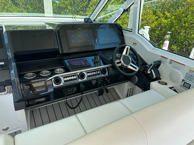 Slide: The Image of 2022 Formula 380 Super Sport Crossover helm with modern controls and sleek design. - 12