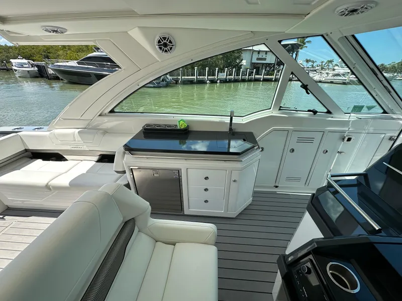 Slide: The Image of 2022 Formula 380 Super Sport Crossover interior with luxurious seating and sleek design. - 25