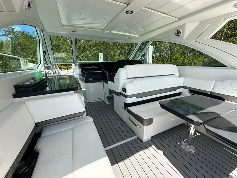 Slide: The Image of 2022 Formula 380 Super Sport Crossover interior with white seating and sleek design. - 26