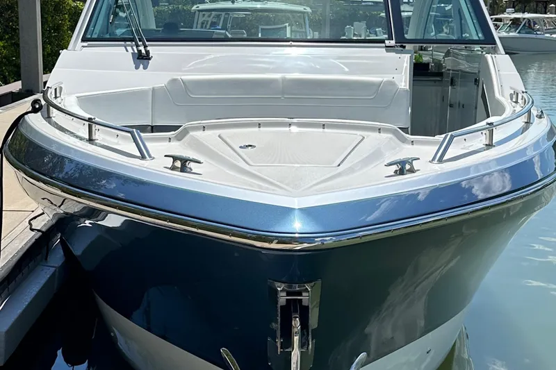 Slide: The Image of 2022 Formula 380 Super Sport Crossover boat docked, showcasing sleek design and modern features. - 3