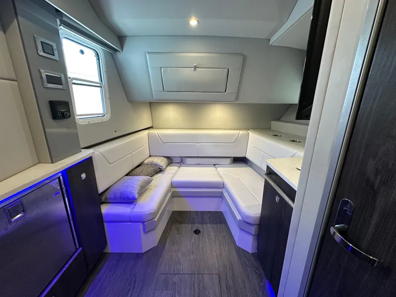 Slide: The Image of 2022 Formula 380 Super Sport Crossover interior with modern seating and ambient lighting. - 31