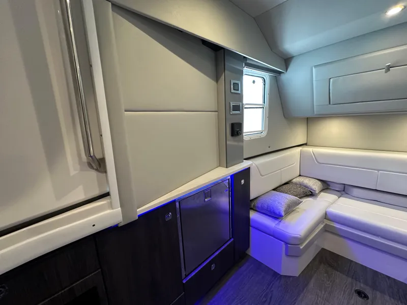 Slide: The Image of 2022 Formula 380 Super Sport Crossover interior with modern seating and ambient lighting. - 32