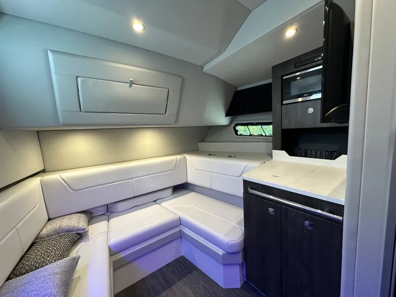 Slide: The Image of 2022 Formula 380 Super Sport Crossover interior with modern seating and cabinetry. - 33