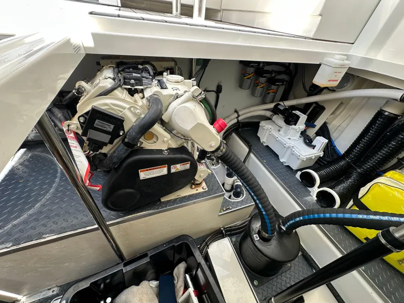 Slide: The Image of Engine compartment of 2022 Formula 380 Super Sport Crossover, showcasing mechanical components and wiring. - 39