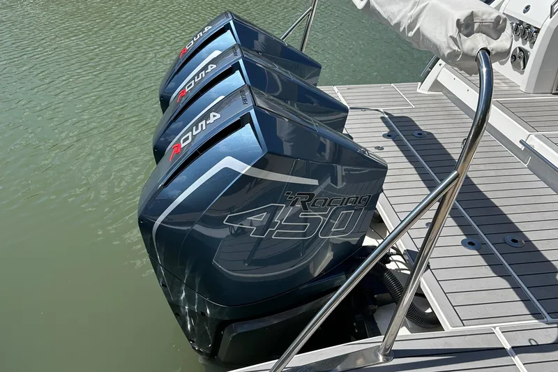 Slide: The Image of Triple outboard engines on a 2022 Formula 380 Super Sport Crossover boat. - 6