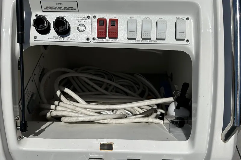 Slide: The Image of Control panel and storage compartment on a 2022 Formula 380 Super Sport Crossover boat. - 9