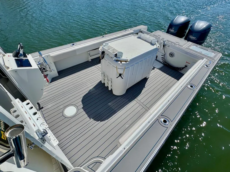 Slide: The Image of 2016 Parker 2820 XLD Sport Cabin boat deck with twin engines on water. - 12