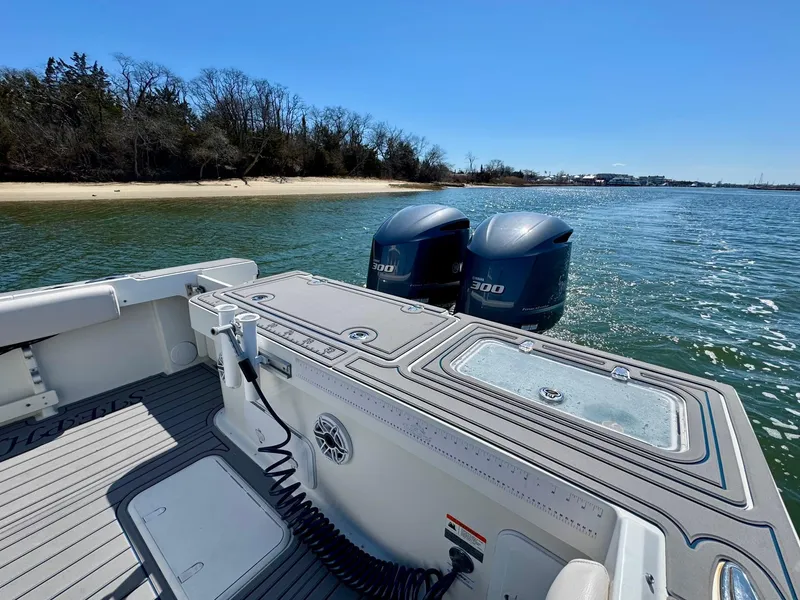 Slide: The Image of 2016 Parker 2820 XLD Sport Cabin boat with twin Yamaha 300 engines on calm water. - 18
