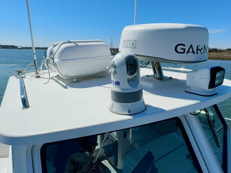 Slide: The Image of 2016 Parker 2820 XLD Sport Cabin with radar and camera equipment on the roof. - 21