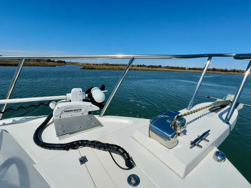 Slide: The Image of 2016 Parker 2820 XLD Sport Cabin boat with Minn Kota motor on calm water. - 8