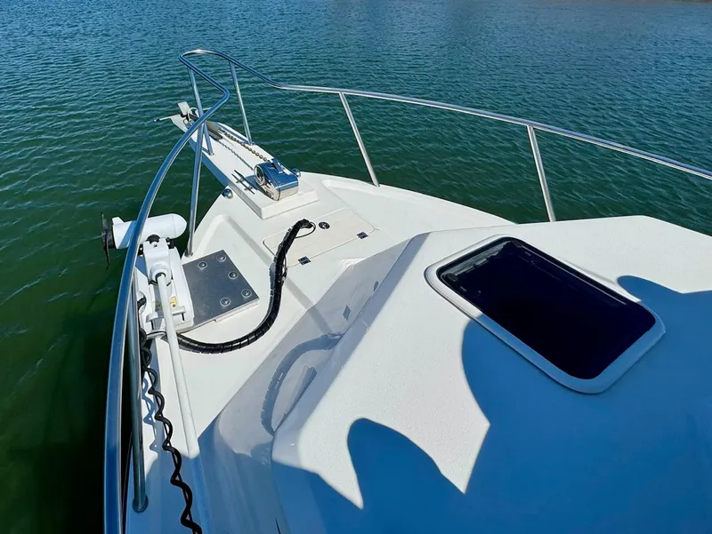 Slide: The Image of 2016 Parker 2820 XLD Sport Cabin boat deck on calm water. - 9