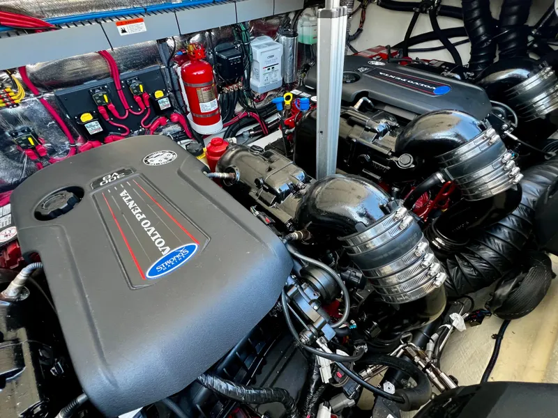 Slide: The Image of Engine room of a 2018 Regal 33 Express boat, featuring Volvo Penta engines. - 15