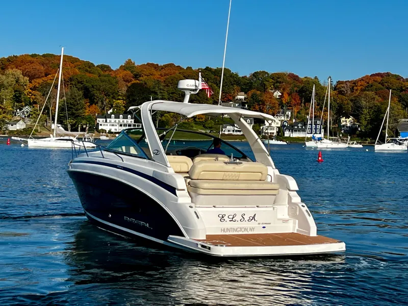 Slide: The Image of 2018 Regal 33 Express boat interior with helm, seating, and sunlit view. - 24